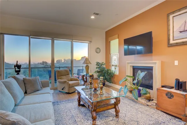 a bed room with furniture and a floor to ceiling window