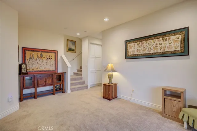a view of a workspace with furniture and a bookshelf