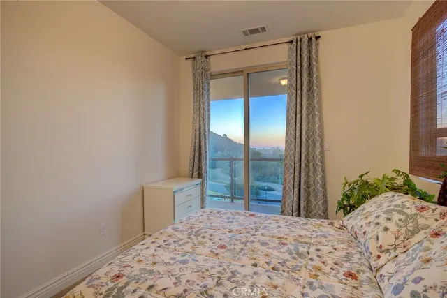 a view of a chairs and table in the balcony