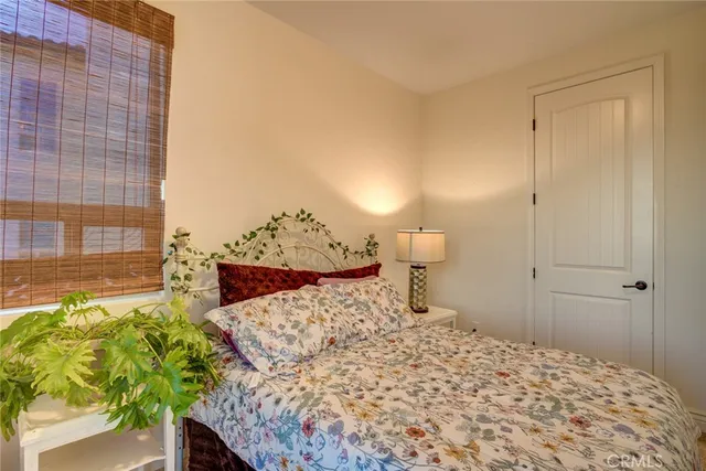 a view of a city from a balcony with furniture