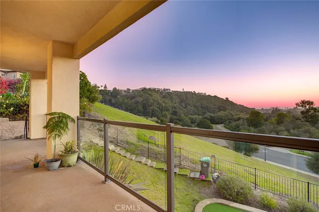 an aerial view of residential house with an outdoor space and seating