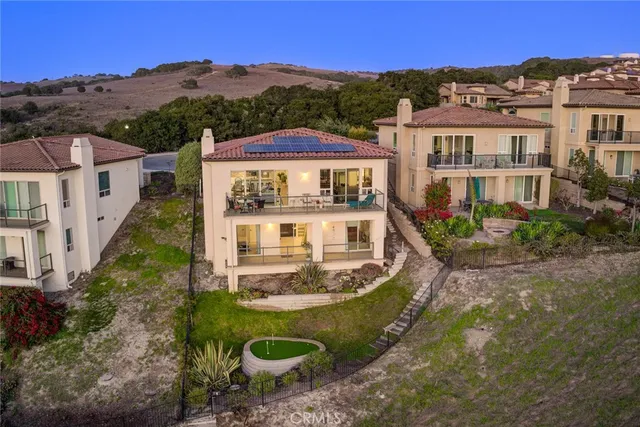 a front view of a house with yard