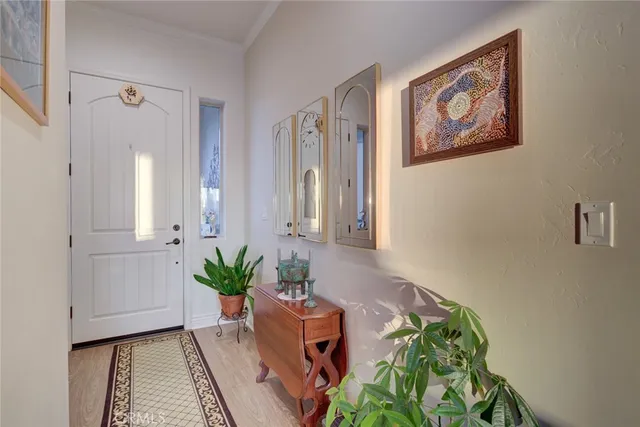 a kitchen with stainless steel appliances granite countertop a lot of counter space and wooden floors