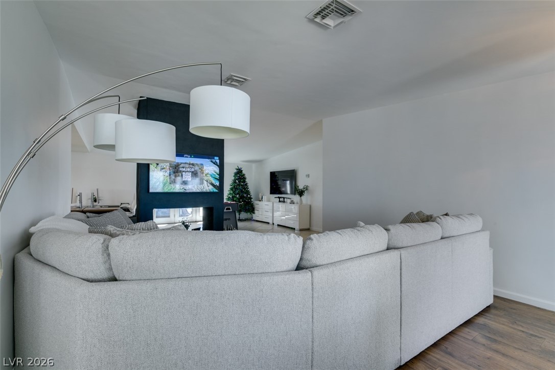 892 North Hollywood Boulevard Las Vegas, NV 89110 - Photo 20 of 81 This inviting living space features warm flooring and central cooling, perfect for comfortable gatherings.