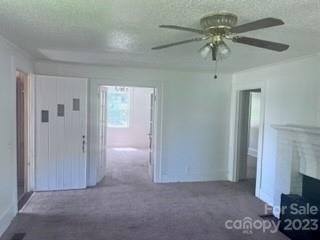 110 Webb Road Shelby, NC 28152 - Photo 3 of 19 a view of an empty room with a chandelier fan