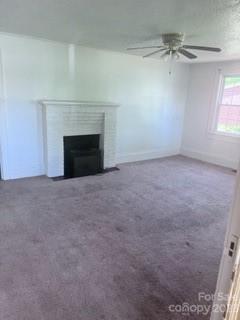 110 Webb Road Shelby, NC 28152 - Photo 5 of 19 a view of an empty room with a fireplace and a window