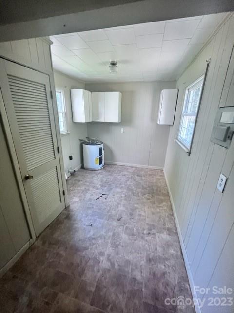 110 Webb Road Shelby, NC 28152 - Photo 9 of 19 a view of a hallway to a room with wooden floor and cabinet