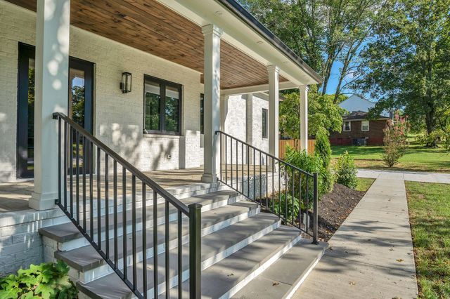 a bathroom with a tub and a shower