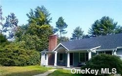 416 Cold Spring Road Laurel Hollow, NY 11791 - Photo 1 of 1 a front view of a house with a garden