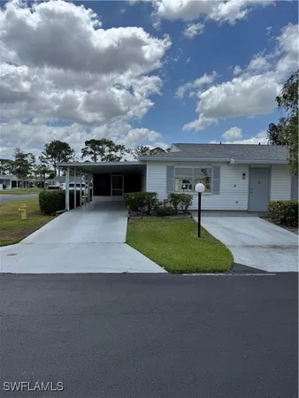 a view of a house with a yard