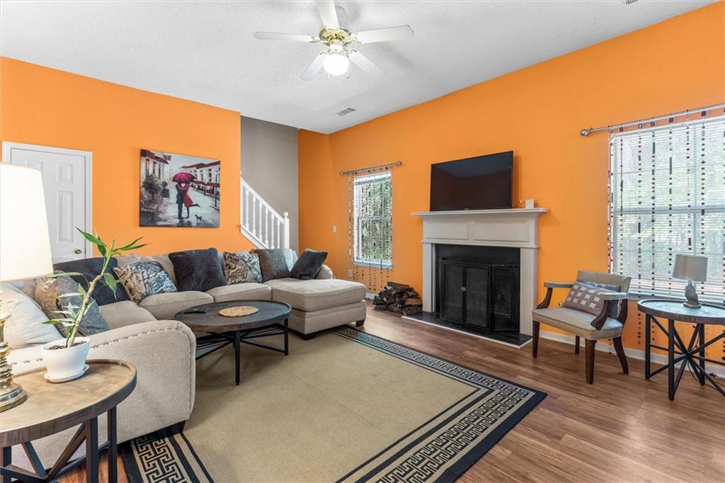 3234 Mineral Ridge Lane Stone Mountain, GA 30087 - Photo 19 of 55 a living room with furniture and a fireplace