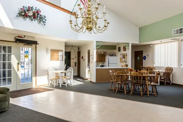a view of a dining room with furniture window and outside view