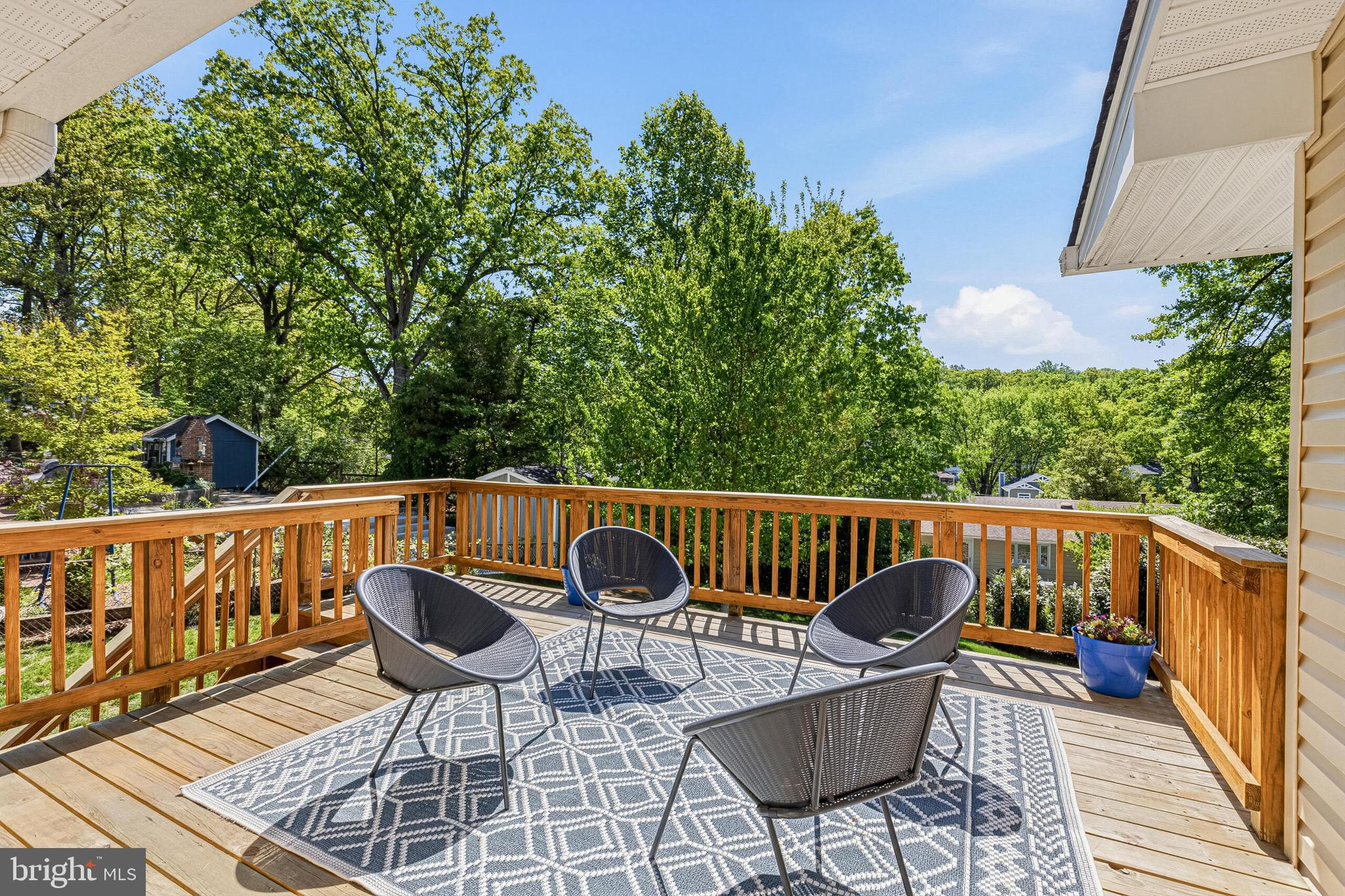 8231 Mc Neil Street Vienna, VA 22180 - Photo 5 of 9 a view of a chairs and table in the balcony