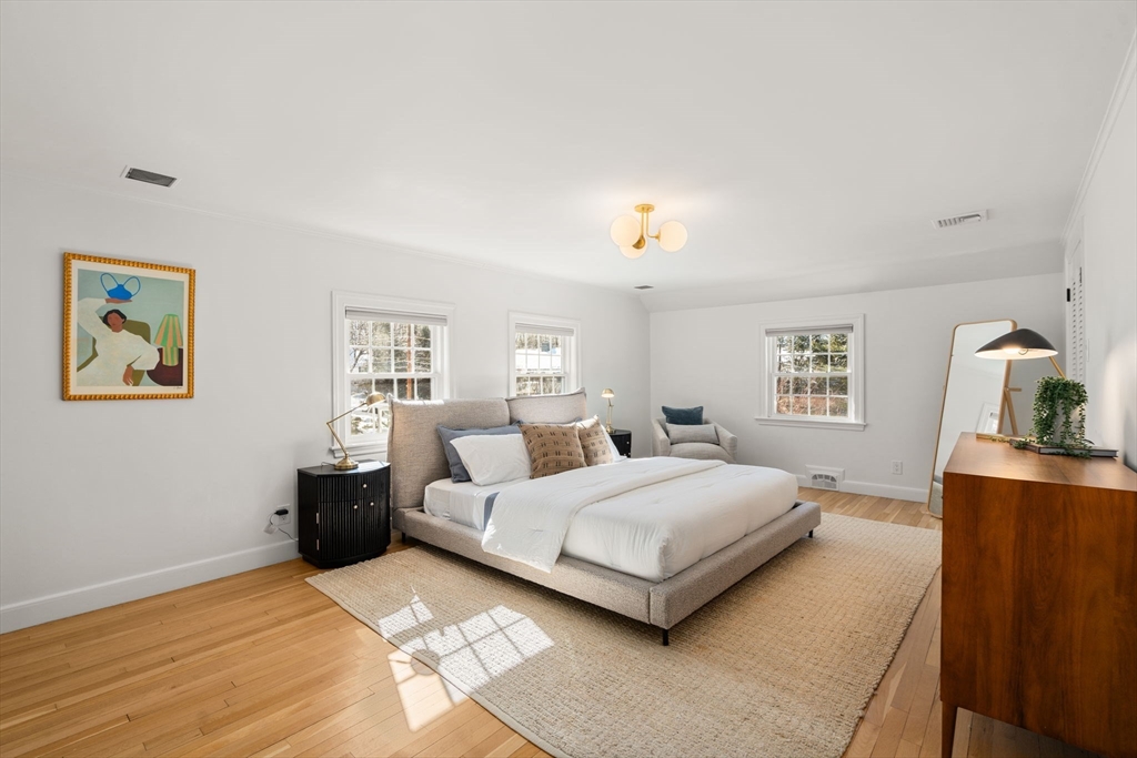 141 Hampshire Road Wellesley, MA 02481 - Photo 17 of 33 a bedroom with a bed and wooden floor
