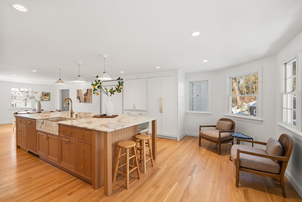 141 Hampshire Road Wellesley, MA 02481 - Photo 4 of 33 a living room with stainless steel appliances kitchen island granite countertop furniture wooden floor and a window