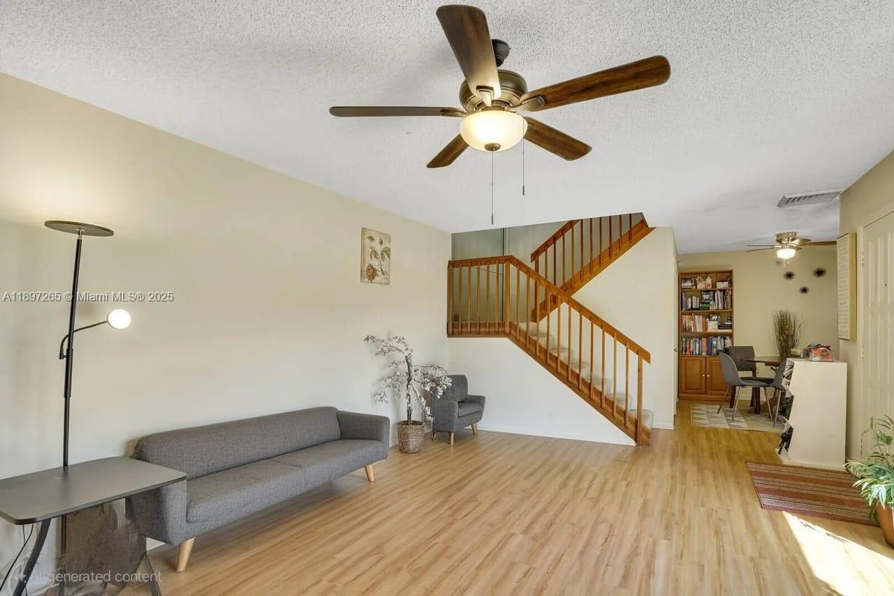 629 6th Way West Palm Beach, FL 33407 - Photo 4 of 10 a view of a livingroom with wooden floor and staircase