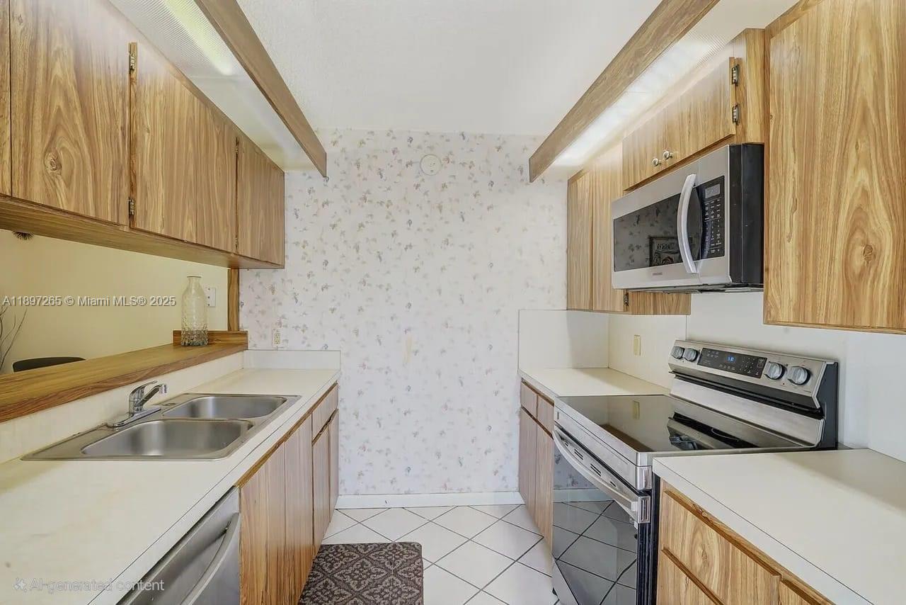 629 6th Way West Palm Beach, FL 33407 - Photo 7 of 10 a kitchen that has a sink and a stove