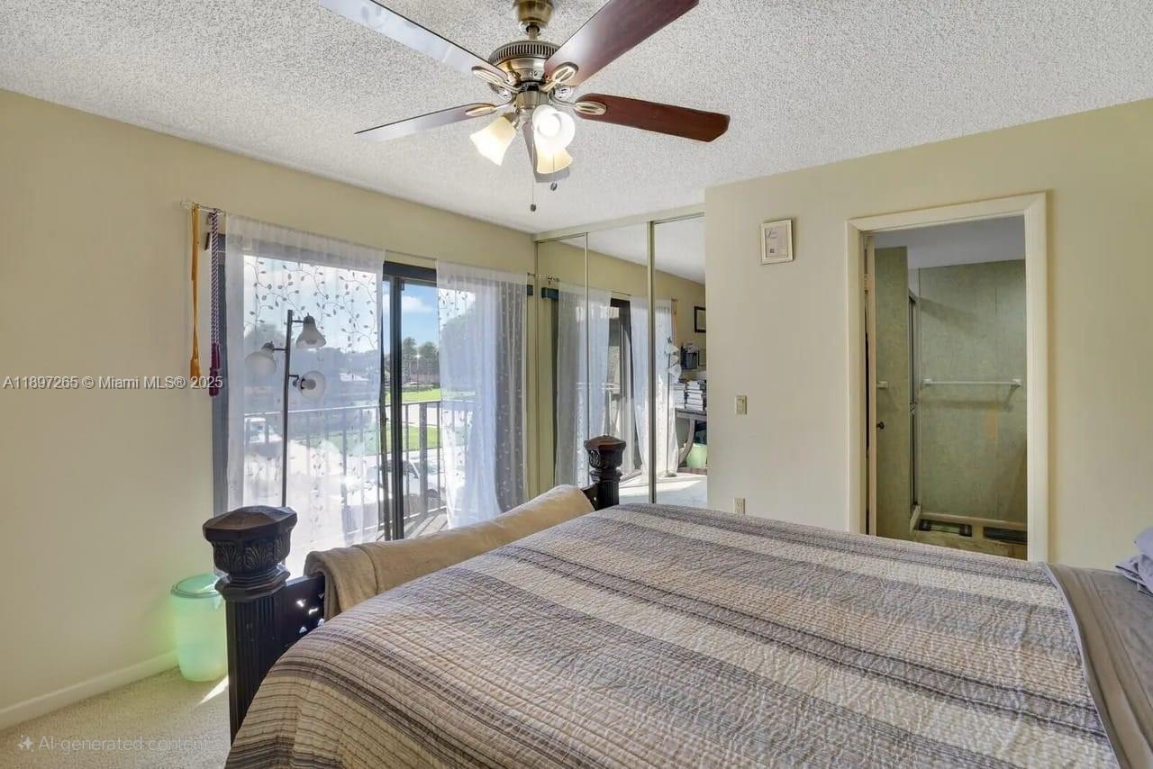 629 6th Way West Palm Beach, FL 33407 - Photo 8 of 10 a bedroom with a large bed and a chandelier