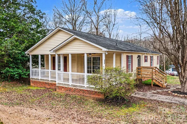 a house with trees in the background