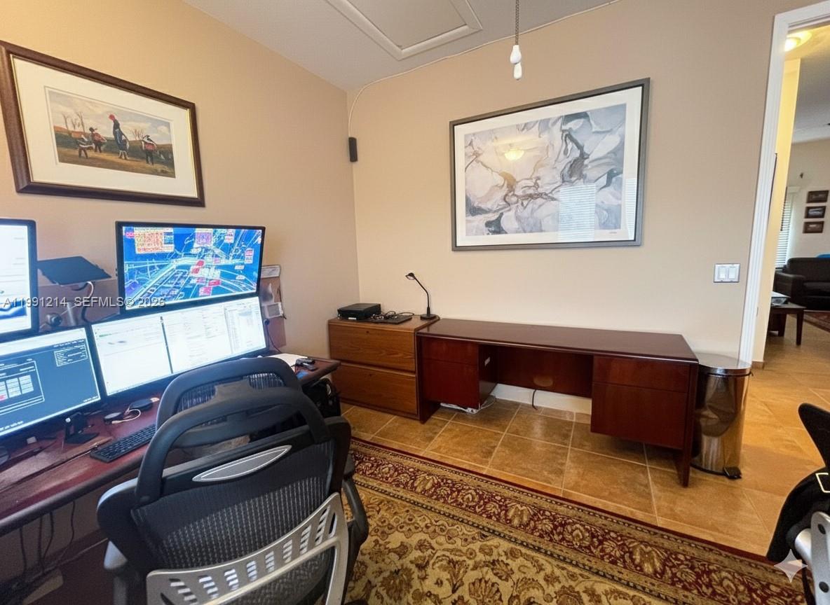 9008 Collins Avenue, Unit 402 Surfside, FL 33154 - Photo 37 of 62 a living room with furniture and paintings on the wall