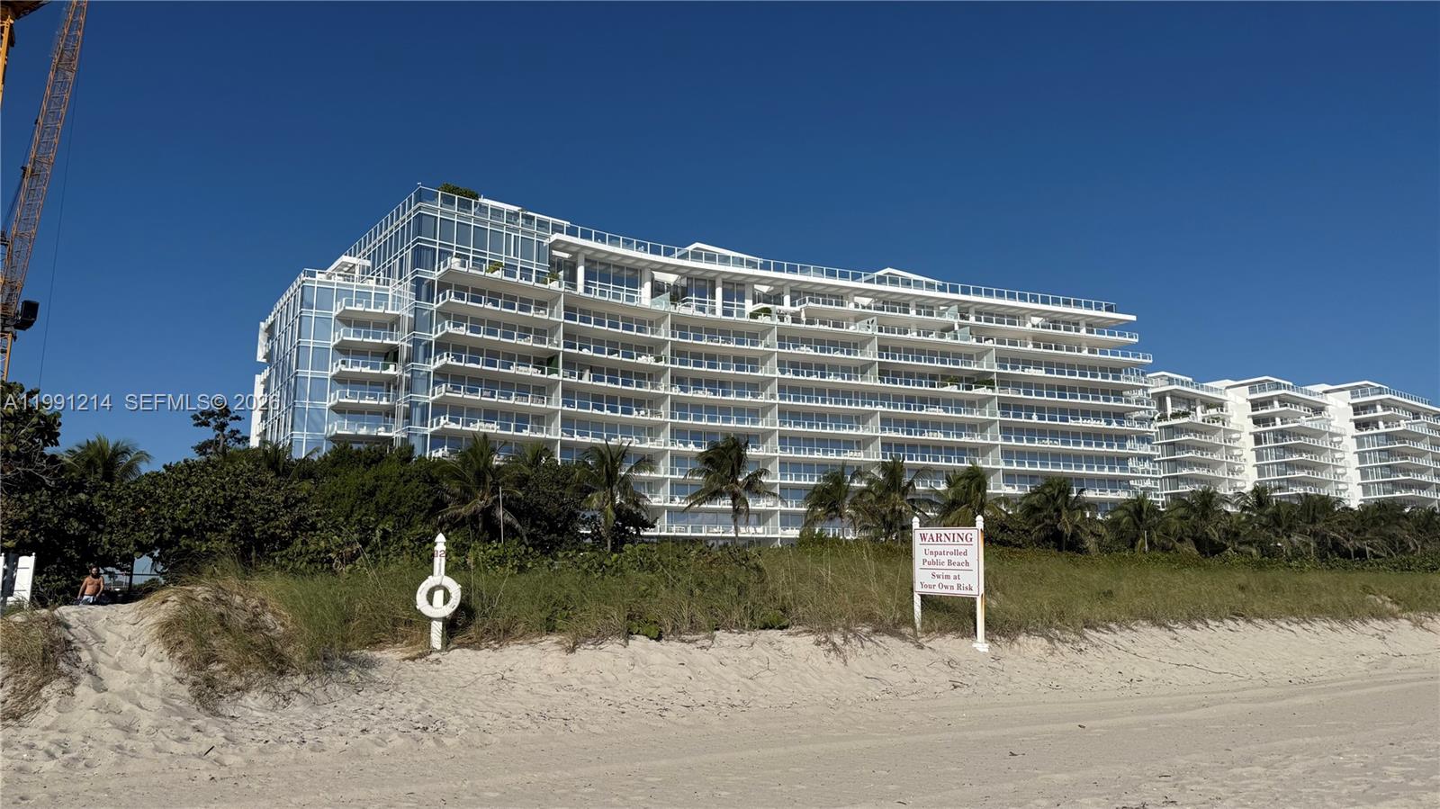 9008 Collins Avenue, Unit 402 Surfside, FL 33154 - Photo 49 of 62 a front view of a building with lake view