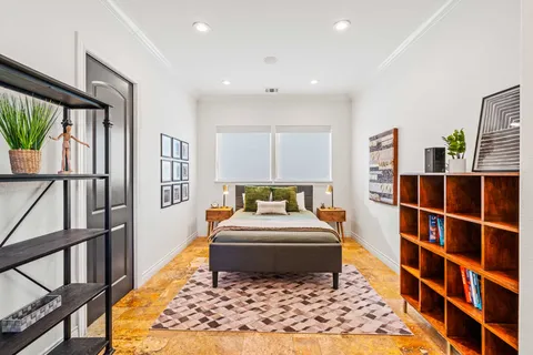 a bathroom with a bathtub and a window