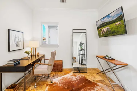 a room with furniture and wooden floor