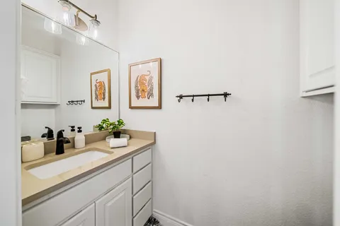 a kitchen with a sink and cabinets