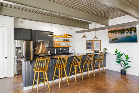 a view of a chairs and table in a patio