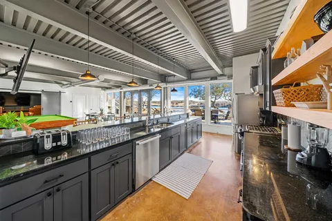 a kitchen with stainless steel appliances granite countertop lots of counter top space