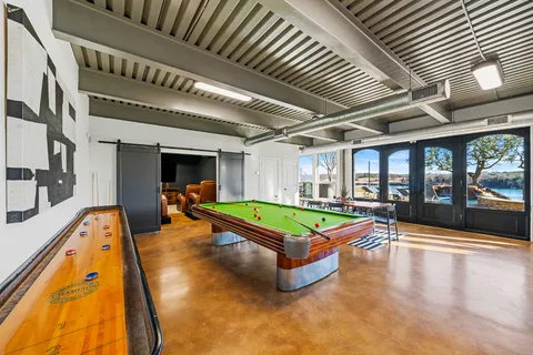 an outdoor space with swimming pool and furniture