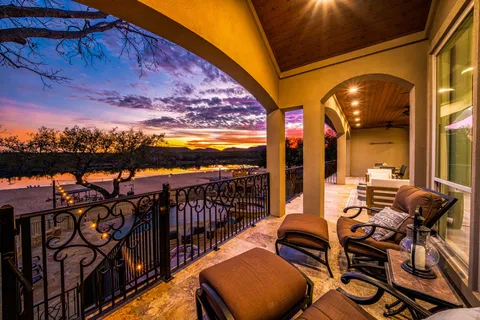 a view of a chairs and table in patio