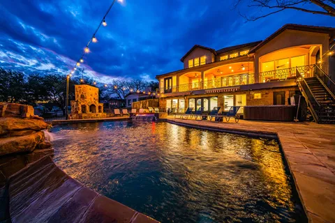 a view of a swimming pool with an outdoor seating