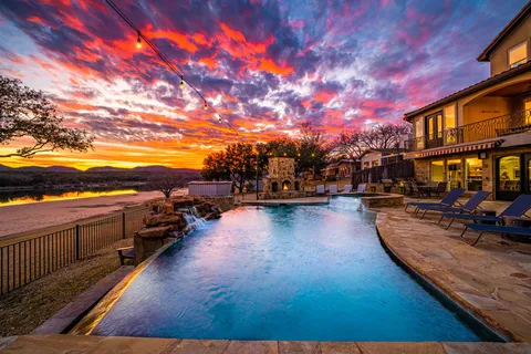 a view of a swimming pool with lounge chair