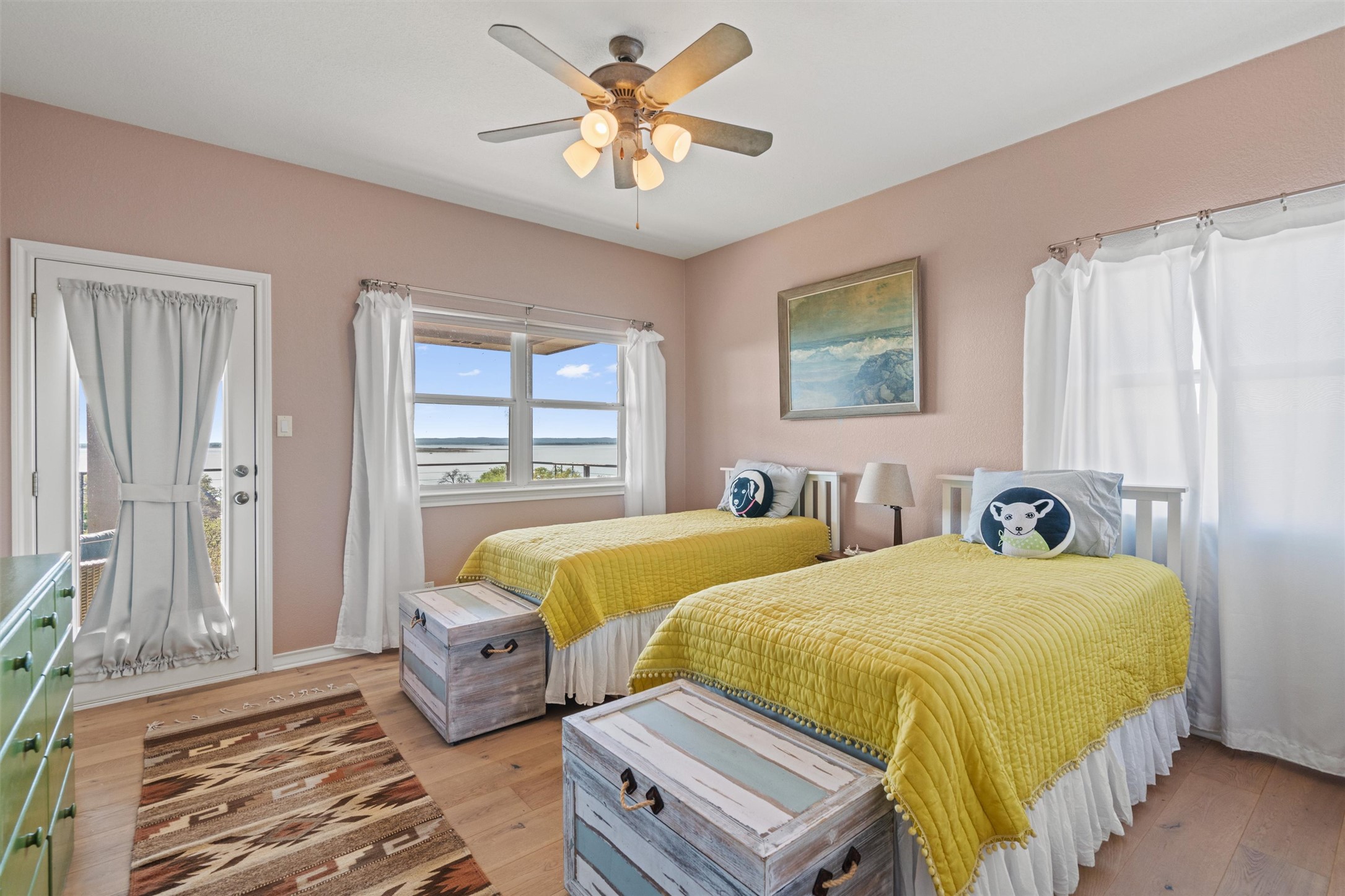 4401 Sunset Cliff Road Burnet, TX 78611 - Photo 23 of 40 Suite 1 on the third floor features a private full bath, walk-in closet, expansive windows, and access to a lake-view patio—one of four private bedroom suites throughout the home.