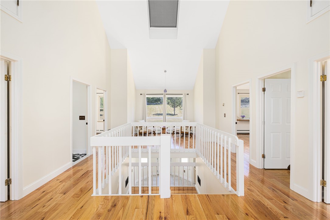 18 J H Dwyer Drive Middletown, RI 02842 - Photo 25 of 42 Upper level landing with cathedral ceilings, skylights and two seating areas
