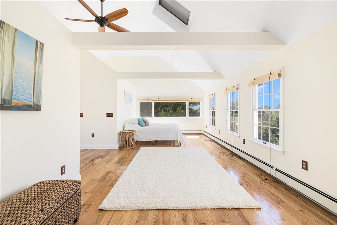 18 J H Dwyer Drive Middletown, RI 02842 - Photo 27 of 42 Spacious primary bedroom with vaulted ceilings, balcony, and large walk-in closet