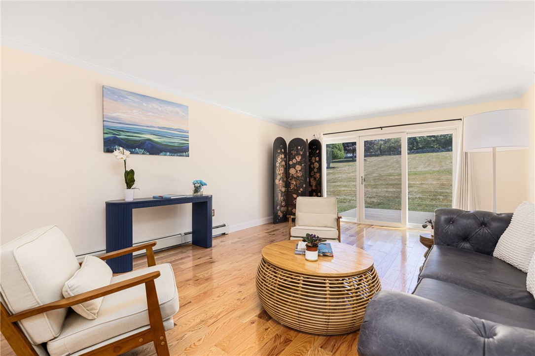 18 J H Dwyer Drive Middletown, RI 02842 - Photo 10 of 42 Living room has sliders leading onto the new deck running the length of the house