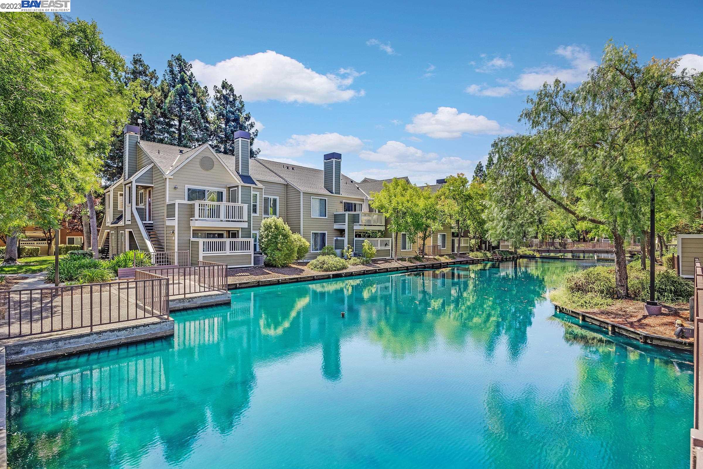 a view of residential house with outdoor space and lake