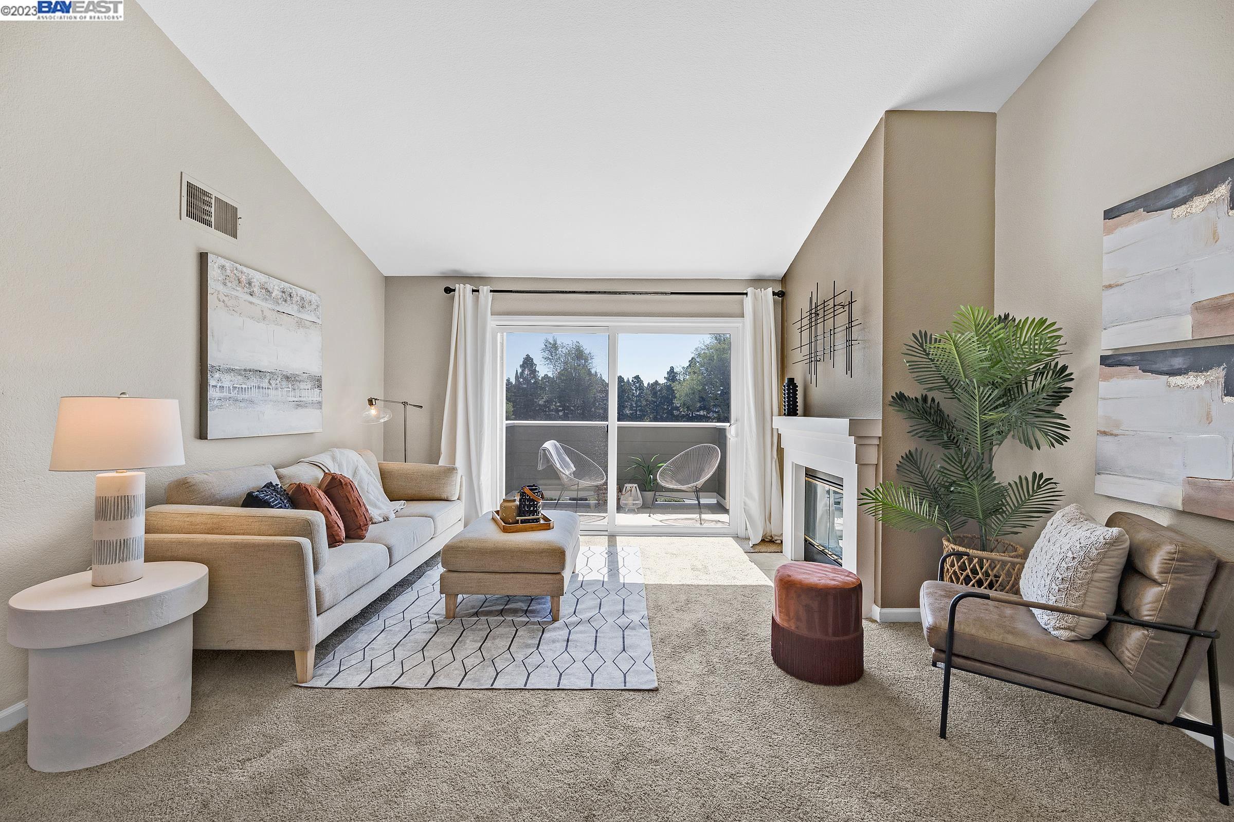 245 Reflections Drive San Ramon, CA 94583 - Photo 12 of 42 a living room with furniture and a large window