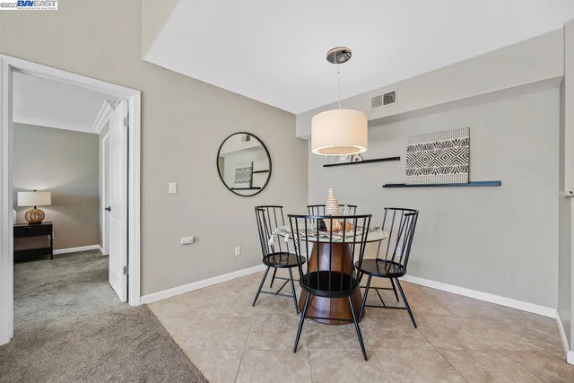 a view of a dining room and livingroom with furniture