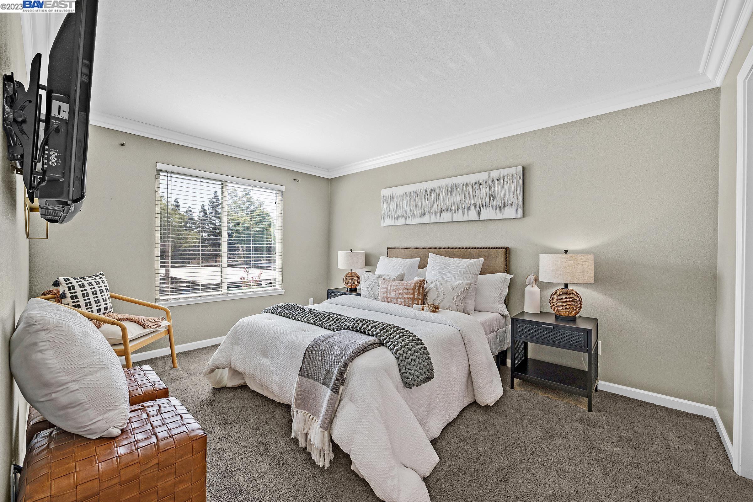 245 Reflections Drive San Ramon, CA 94583 - Photo 17 of 42 a bedroom with bed and glass window