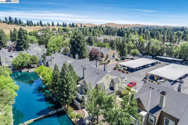 an aerial view of a house with outdoor space