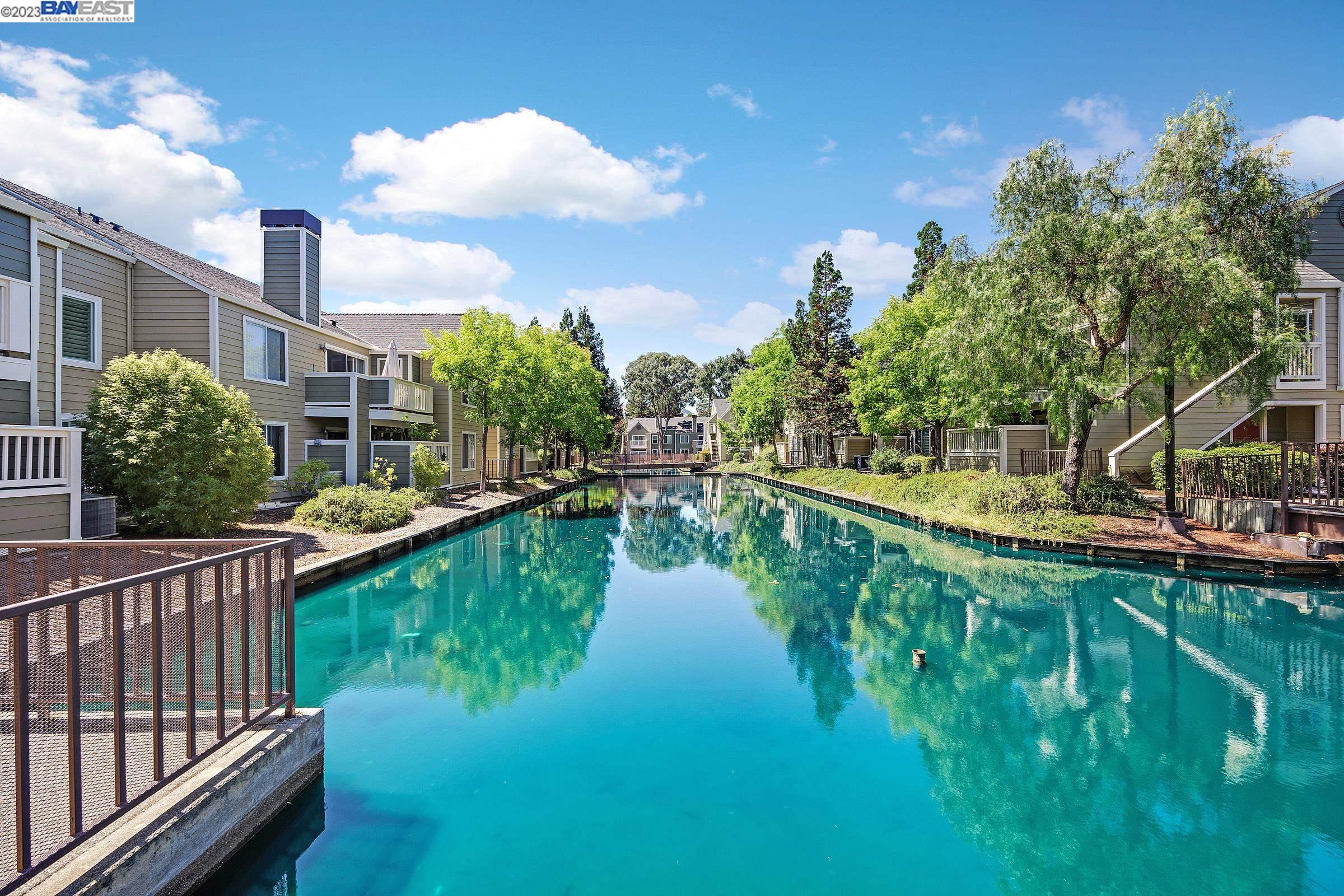 245 Reflections Drive San Ramon, CA 94583 - Photo 32 of 42 a view of a lake with a garden