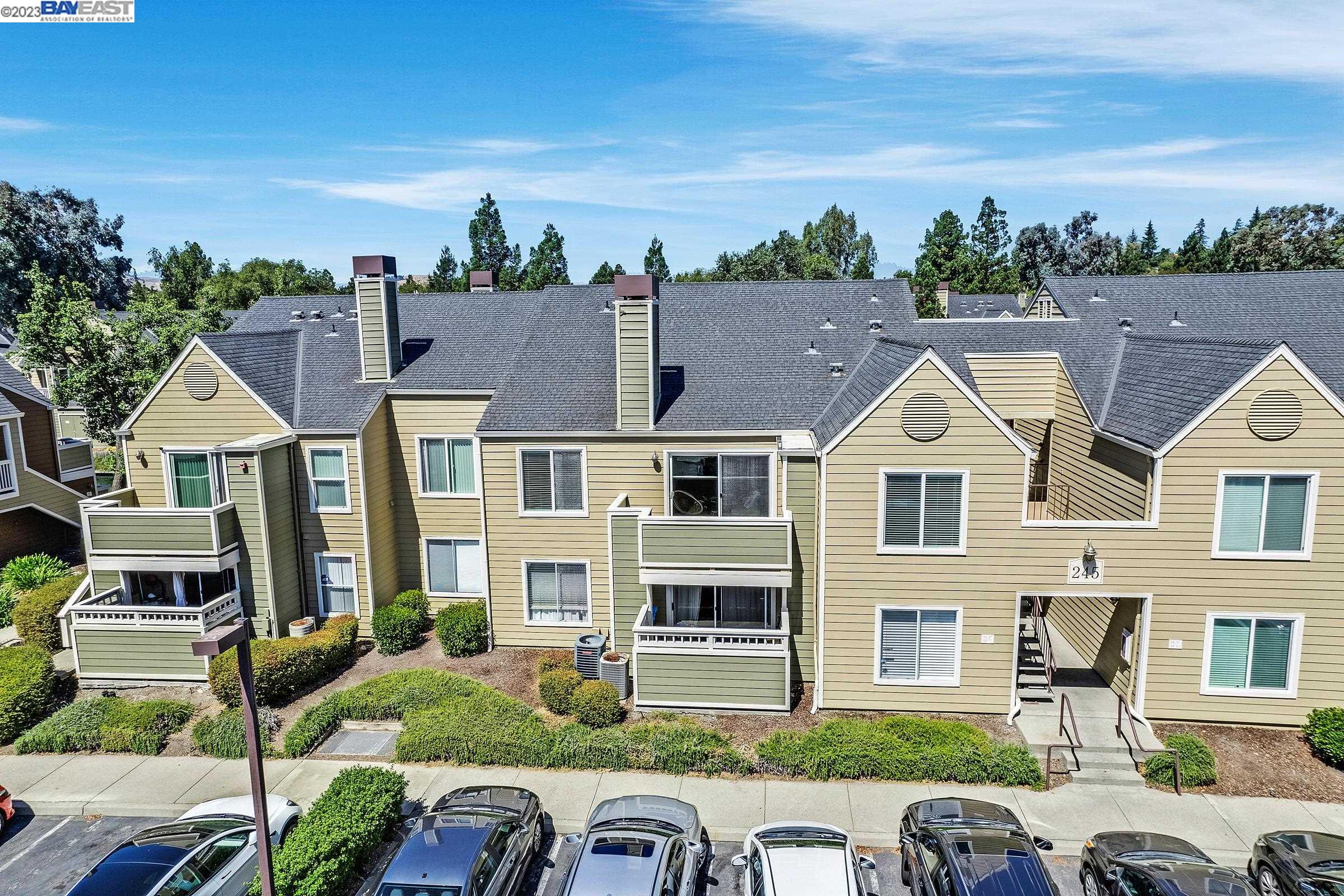 245 Reflections Drive San Ramon, CA 94583 - Photo 4 of 42 a front view of a house with a yard