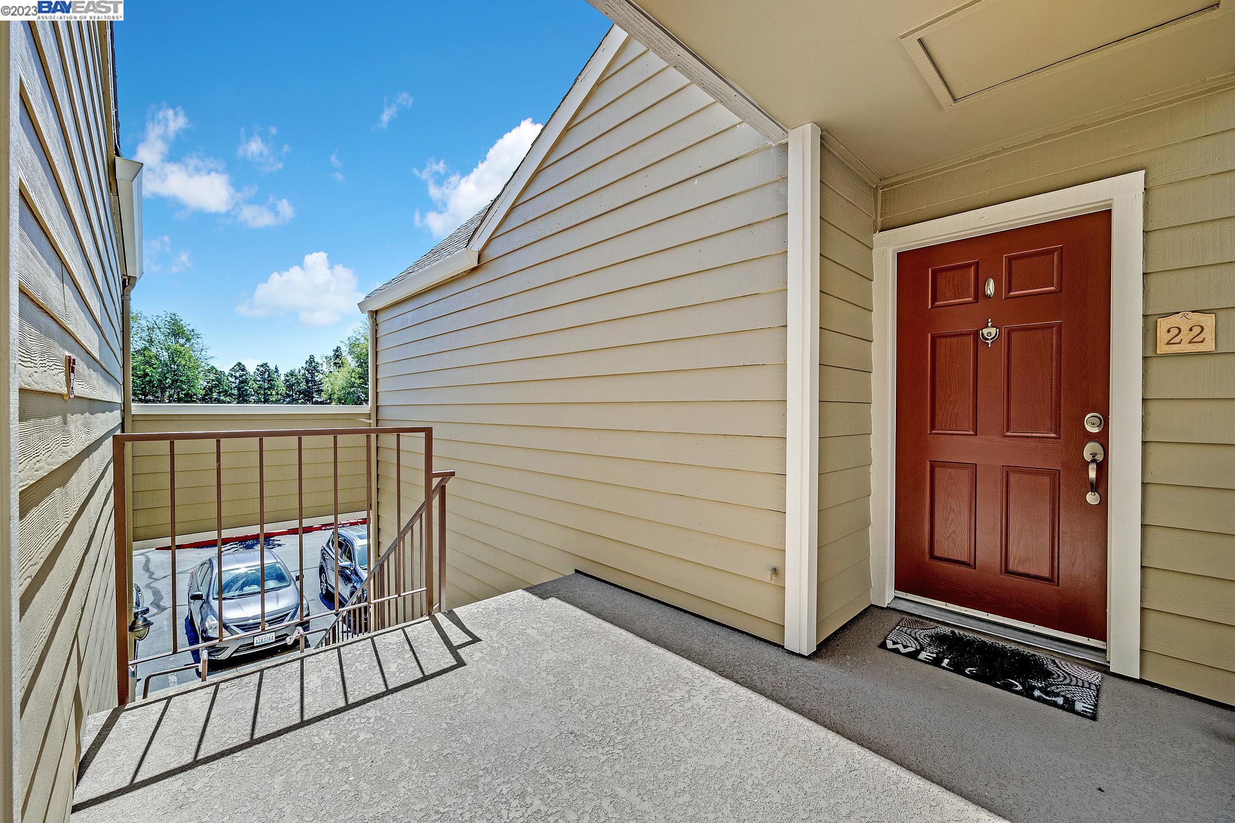 245 Reflections Drive San Ramon, CA 94583 - Photo 7 of 42 a view of a porch with a door and a rug