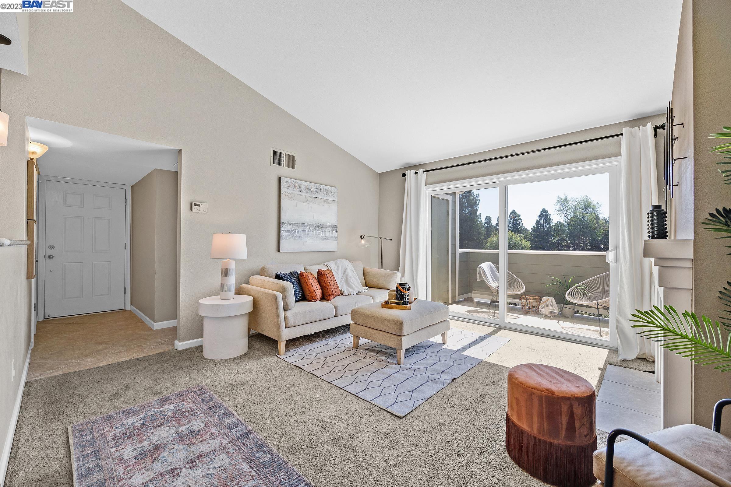 245 Reflections Drive San Ramon, CA 94583 - Photo 10 of 42 a living room with furniture large window and a table