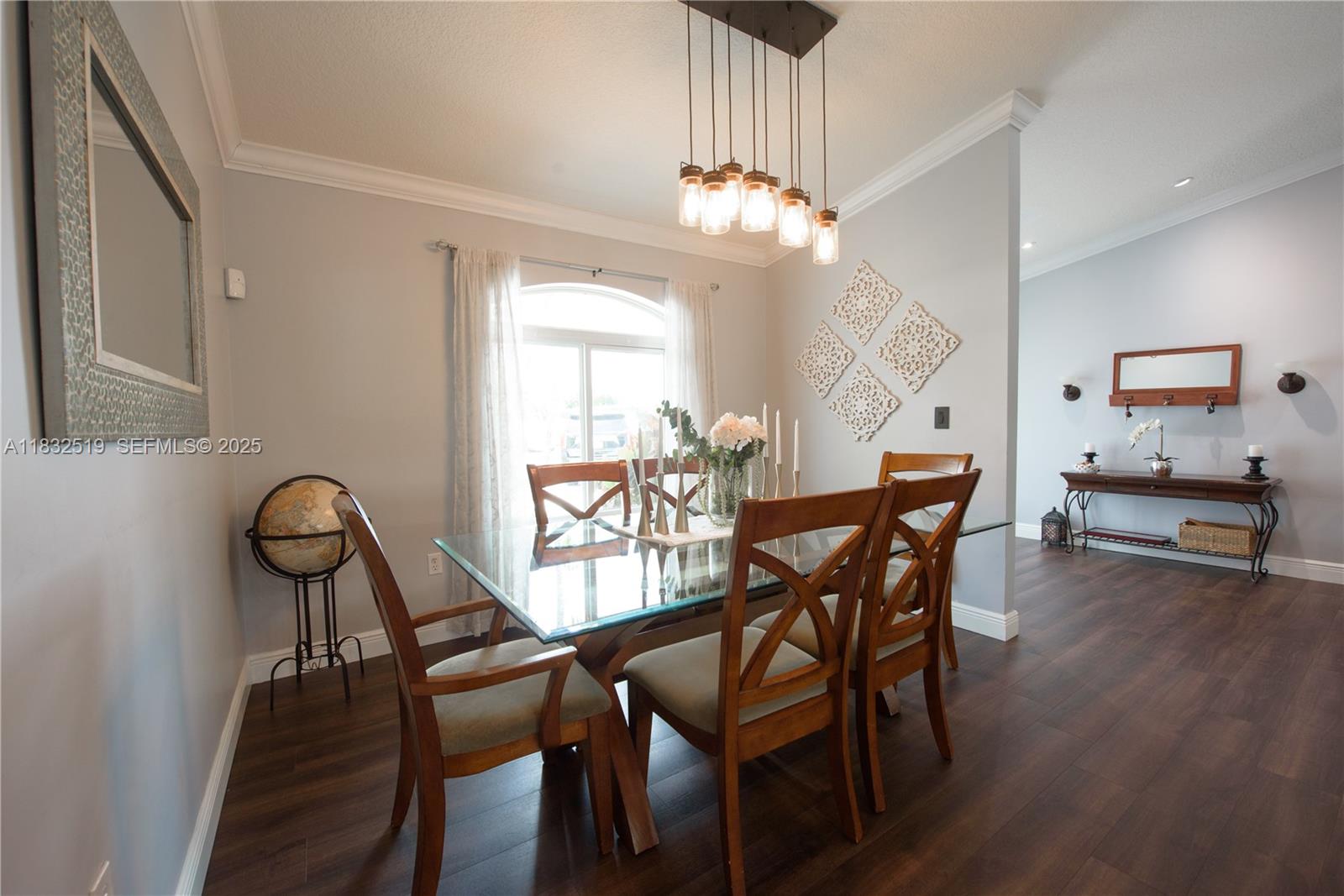 18740 Southwest 297th Street Homestead, FL 33030 - Photo 11 of 46 a view of a dining room with furniture and wooden floor