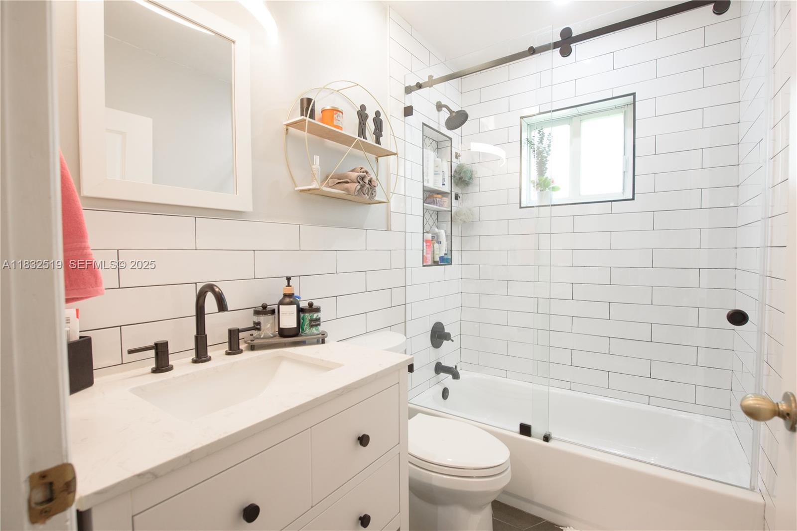 18740 Southwest 297th Street Homestead, FL 33030 - Photo 18 of 46 a bathroom with a sink a toilet and shower