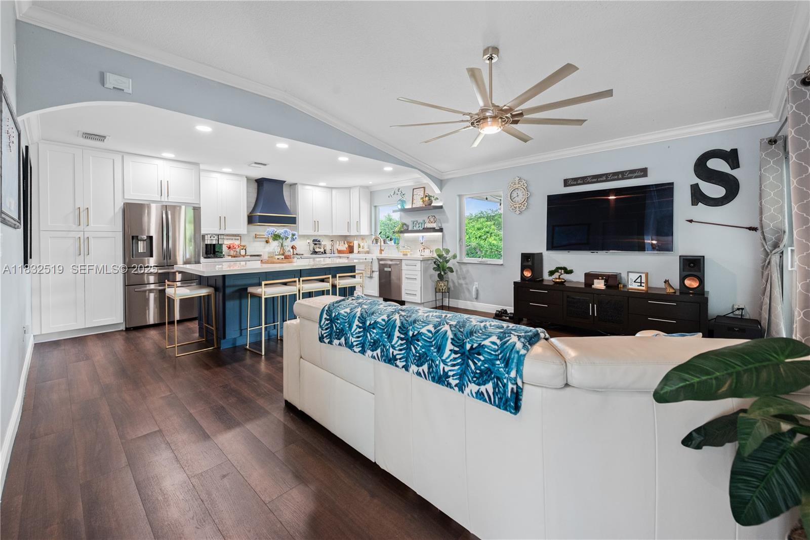 18740 Southwest 297th Street Homestead, FL 33030 - Photo 2 of 46 a living room with stainless steel appliances kitchen island granite countertop furniture a rug kitchen view and a chandelier